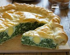 there is a pie on the cutting board