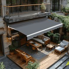 an overhead view of a patio with furniture and plants on the deck, including tables and chairs