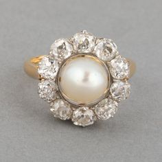 an antique pearl and diamond cluster ring