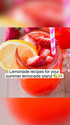 there is a jar with lemonade and strawberries in it