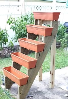 a set of steps made out of wood with planters on them