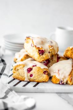 cranberry scones with icing on a plate