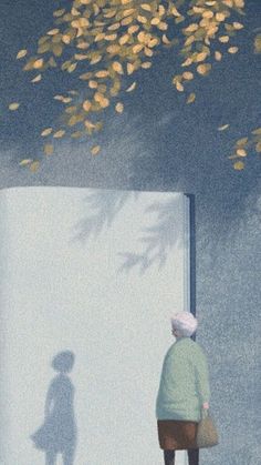 the shadow of a person standing in front of a white wall with leaves on it