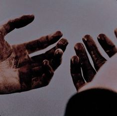 two hands reaching out towards each other