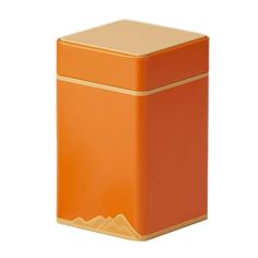 an orange square container with gold trimmings on the top and bottom, sitting in front of a white background