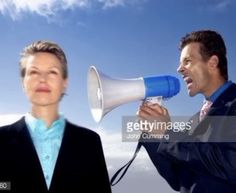 two businesspeople shouting into a megaphone