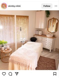 a bed room with a neatly made bed next to a dresser and window sill