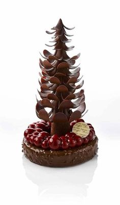 a chocolate christmas tree with cherries on top