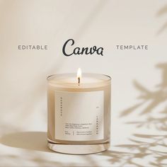 a candle that is sitting in front of a wall with the words canva on it