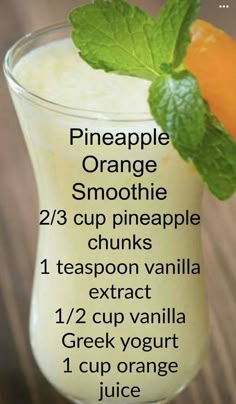 an orange smoothie is shown in a glass with the ingredients to make it tasteful