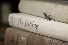 three books stacked on top of each other with the words fly fishing written on them