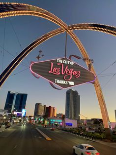 the las vegas sign is lit up in pink and white for valentine's day