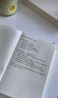 an open notebook sitting on top of a table