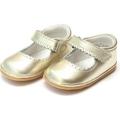 With its darling scalloped trim across the front and strap, the Cara Mary Jane from Angel Shoes can dress up any look. This style tends to run big. You may want to size down; please refer to the size chart. | Angel Shoes | Baby Cara Metallic Scalloped Leather Mary Jane, Gold (Gold Metallic, Size 2)  |  Maisonette collects the best children’s products from around the world (unlike Zulily, Etsy, The Tot, Farfetch Kids, Childrensalon, Crate and Kids, Kohls, Wayfair, Buy Buy Baby, Nordstroms, Mini B Angel Shoes, Gold Dress Shoes, Kendra Scott Bracelet, Designer Diaper Bag, Kendra Scott Necklace, Shoes For Kids, Kendra Scott Earrings, Scalloped Trim, Buy Buy