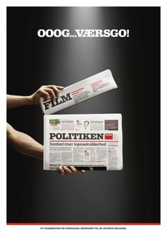 a person holding up a newspaper with the word politiken written on it in german