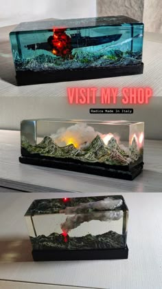 two aquariums with lights on each side and the words visit my shop above them