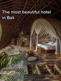 a bed sitting on top of a wooden floor next to a canopy over a bed