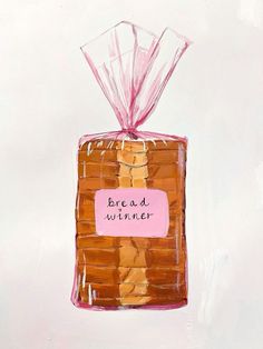 a piece of bread wrapped in plastic with a pink ribbon on top that says bread winner