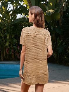 Get ready to turn heads in the Christa Crochet Mini Sweater Dress! This dress features a unique crochet knit fabrication, making it perfect for any occasion. Stay cozy and stylish with its mini length and on-trend khaki color. Perfect for a playful and fun fashion statement (without the hassle of a full length sweater)! Size Guide: Model is 5’2” tall, and has a 33.2” bust, 24.5”waist, & 36.7” hips. She is wearing a S / US 4 / AU 8. This dress is true to size. Feature: Scallop Neckline. Short sleeves. Crochet knit fabrication. Mini Length. Relax Fit. Scallop hem. Not Lined. Material: 100% Viscose. Care Instructions: Machine wash / Cold hand wash. Casual Crochet Dress With Pointelle Knit And V-neck, Summer Textured Knit Crochet Dress, Textured Knit Crochet Summer Dress, Knitted Mini Dress For Beach, Knitted Mini Dress For The Beach, Summer Crochet Knit Dress With Textured Design, Knit V-neck Mini Dress For The Beach, Knit V-neck Mini Dress For Vacation, Summer Textured Crochet Knit Dress