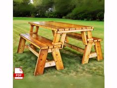 a wooden picnic table and bench in the grass