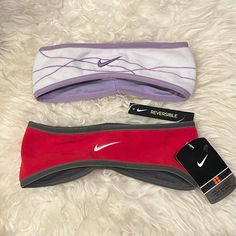 three nike headbands laying next to each other on a white furnishing