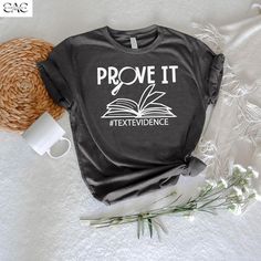 Prove it Text Evidence Shirt, ELA Teacher Shirt, English Teacher shirt ,Teacher Shirt ,Reading Teacher Shirt, Research Shirt,Prove It Shirt 👉How Do I Order👈 1️⃣ Please review all the information provided before placing an order 2️⃣ Select the shirt size using the drop down menu. 3️⃣ Select the color of the shirt using the following drop down menu. * * Different styles of shirts may have different shades of same color choice due to different manufacturer brands. * * For this reason, we recommend you to match shirts from the same styles if you want precisely matching colors (ex. Unisex, V-necks, Toddler, etc.). 4️⃣ Need more Items? Add the current item in the cart. And If you like to add more items to your order please press the back button and repeat steps 1-3 again. 5️⃣ Once all your des Reading Teacher Gifts, English Teacher Shirt, Funny English, English Teacher Gifts, Text Evidence, Ela Teacher, Reading Teacher, English Teacher, Prove It