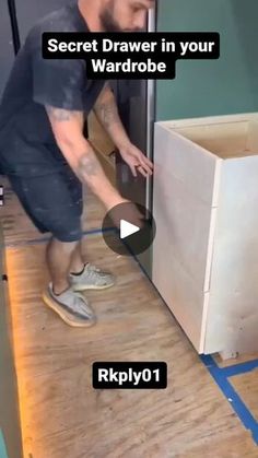 a man is opening the drawer in his kitchen