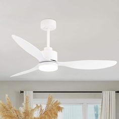 a white ceiling fan in a living room