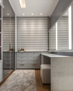 a modern kitchen with marble counter tops and wooden flooring, along with built - in shelving units