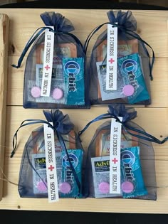 three bags of soap sitting on top of a wooden box