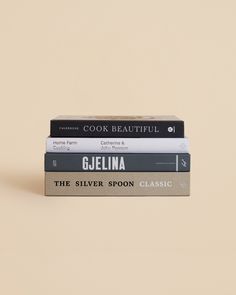 three books stacked on top of each other in front of a beige background with the title cook beautiful