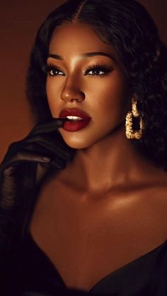 a woman in black dress and gloves with red lipstick on her face, wearing gold earrings