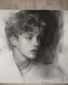 a black and white drawing of a young man