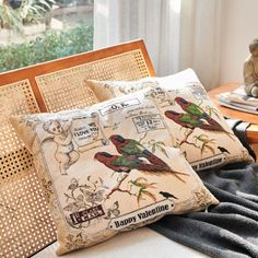 two pillows sitting on top of a wooden table