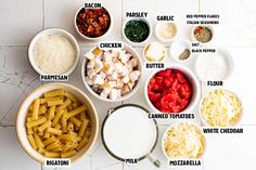 an overhead view of different types of pasta in bowls and on the table with ingredients labeled