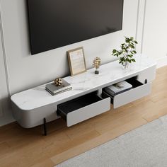 a white table with two drawers and a tv on the wall