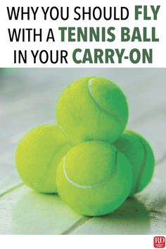 a pile of tennis balls sitting on top of a wooden floor next to the words why you should fly with a tennis ball in your carry - on