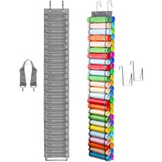 a rack with many different colored crayons hanging from it's sides next to a pair of scissors