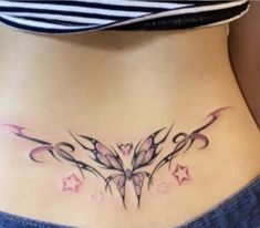 a woman's stomach with tattoos on it and stars in the bottom half - back