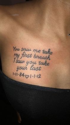 a woman with a tattoo on her chest that says, you saw me take my first breath