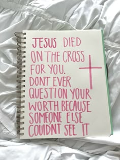 a note book with the words jesus died on the cross for you don't ever question your worth because someone else couldn't