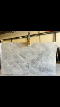 a large white marble slab in a warehouse