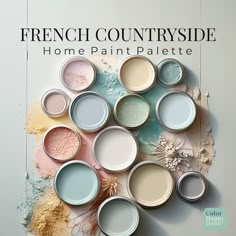 there are many different colors of paint on the wall and in the background is an advertisement for french countryside home paint palettes