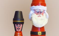 a santa clause doll next to a toy nutcracker