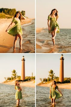 a woman in a green dress standing on the beach