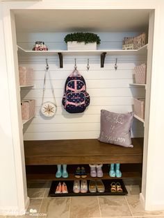 a room with some shoes and a backpack on the shelf