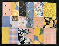 a patchwork quilt with flowers, lemons, and honeybeests on it