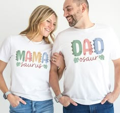 a man and woman standing next to each other wearing t - shirts with the words'mamma dad, saur up'printed on them