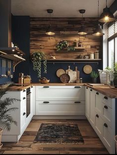 a kitchen with wooden walls and white cabinets, potted plants on the counter top