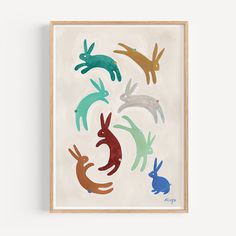 an art print with different colored rabbits on it